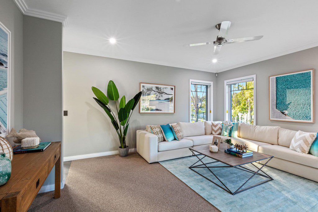 A living room filled with furniture and a large window