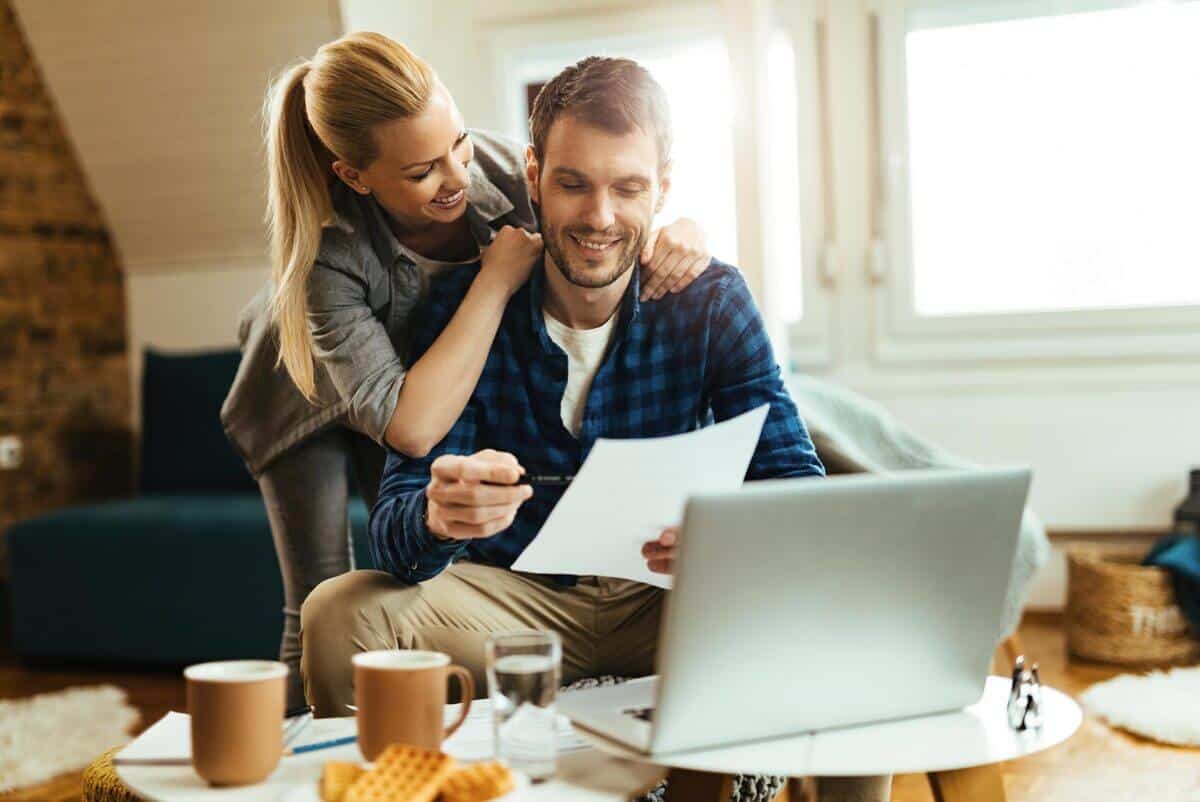 Couple reviewing their home build budget together